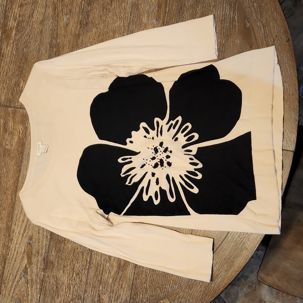 Tan sweater with black flower